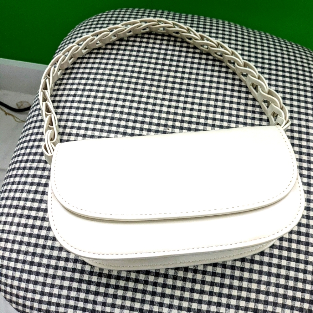 Woman's brand new white purse